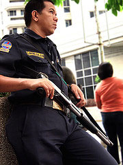 Armed Security Guard Training an Armed Security Guard guarding an Armored Truck